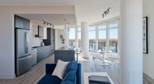 Open concept floorplan with floor-to-ceiling windows