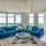 a living room with a large blue couch