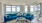 a living room with a large blue couch