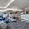 a large lounge with  a bar and seating