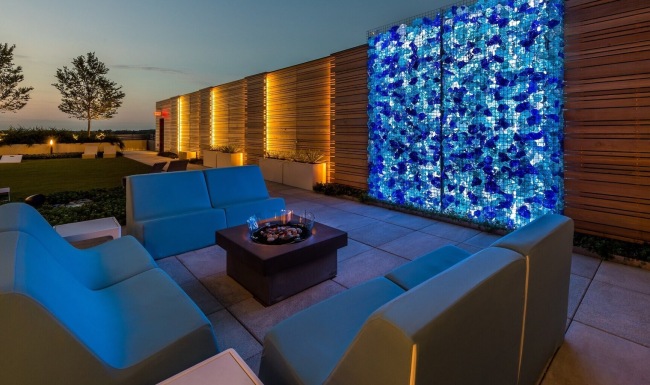 rooftop lounge with fire pit and art piece