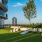 a building with a lawn and benches