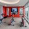 a gym with exercise equipment and tv