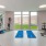 a room with exercise equipment and yoga mats