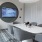a conference room with a table seating and tv