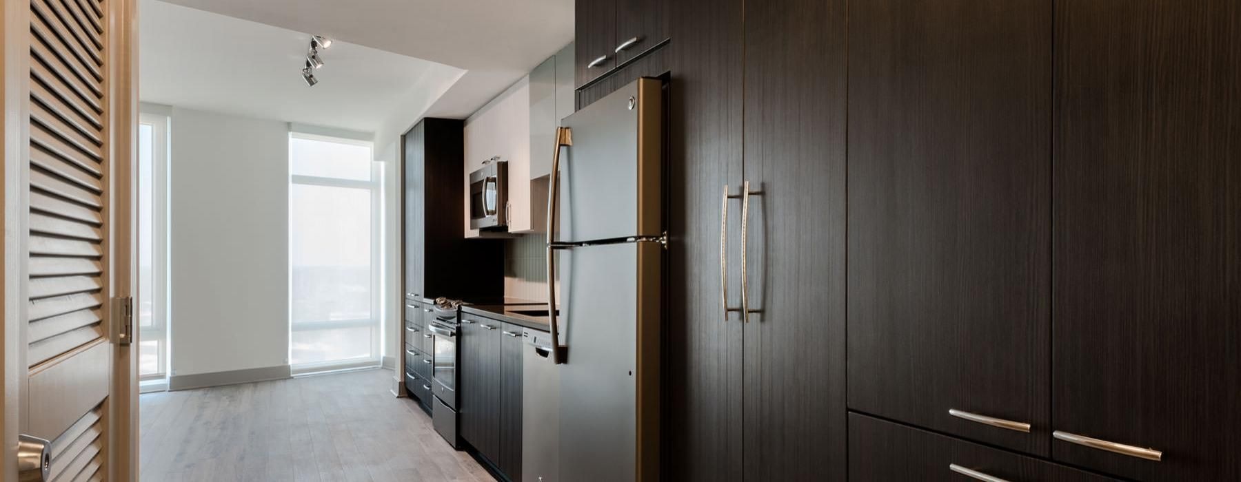 a kitchen with wooden cabinets