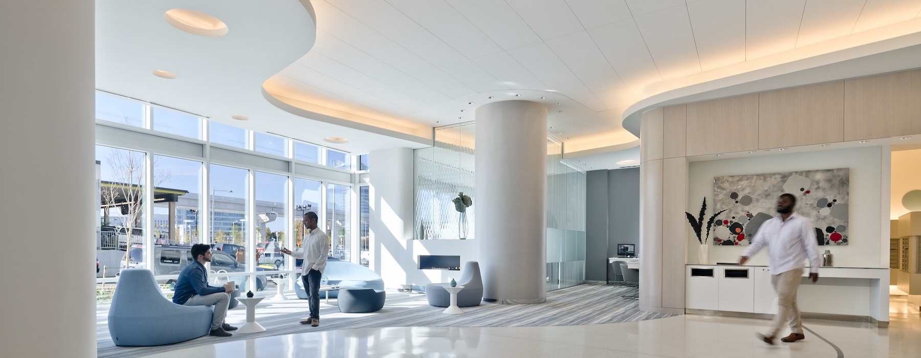 lobby with people seated and windows