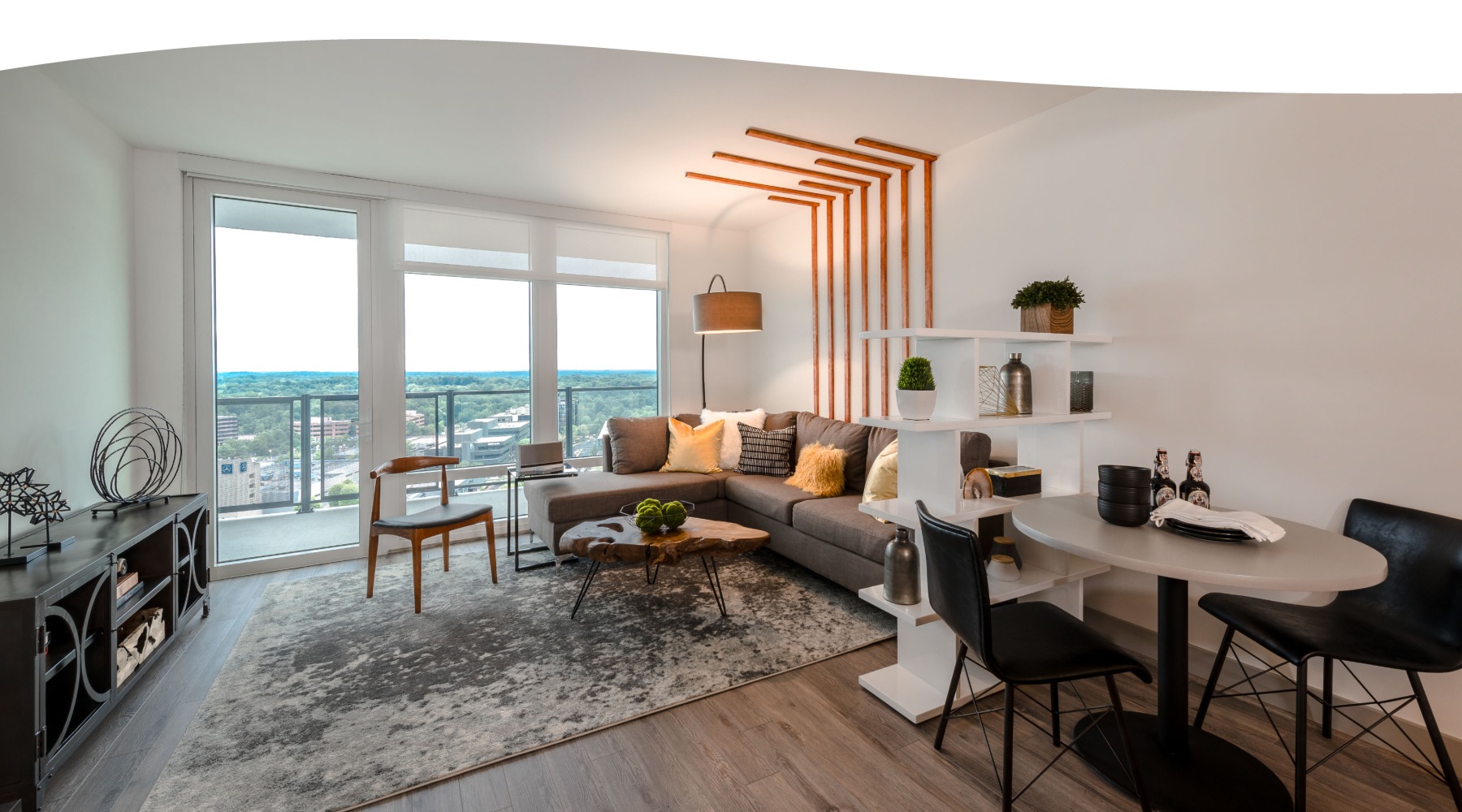 Generous living spaces with beautiful natural lighting a living room with large windows