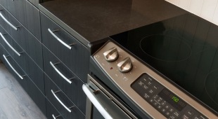 The Adaire's chef-caliber kitchens feature slate-finish appliances and Delta Brizio fixtures.